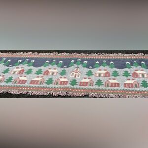 Table runner with churches, trees and houses.